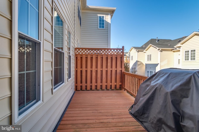 wooden deck featuring area for grilling