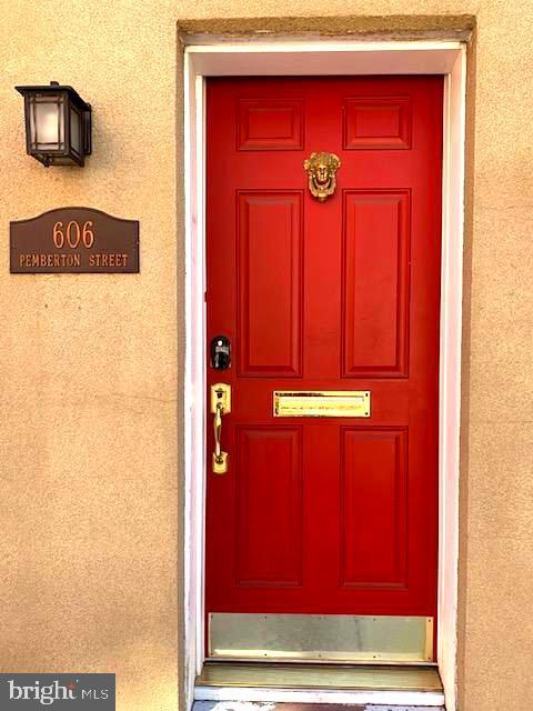 doorway to property with stucco siding