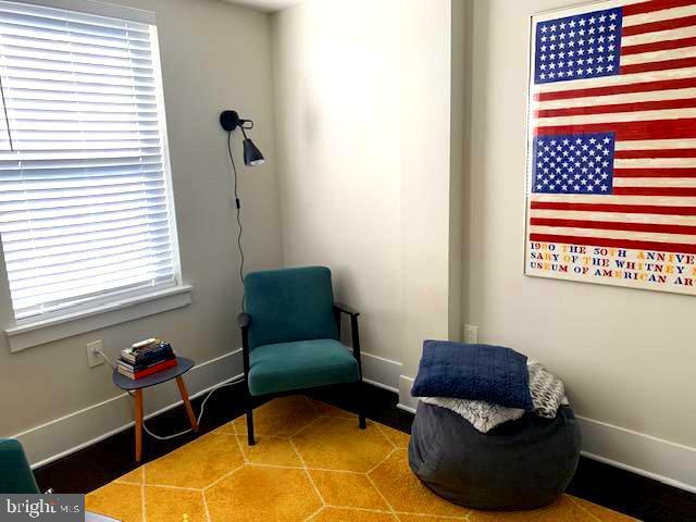 sitting room featuring baseboards