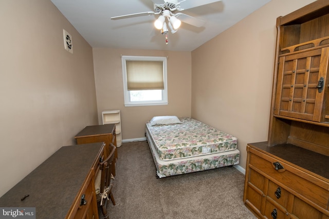 bedroom with carpet flooring, a ceiling fan, and baseboards