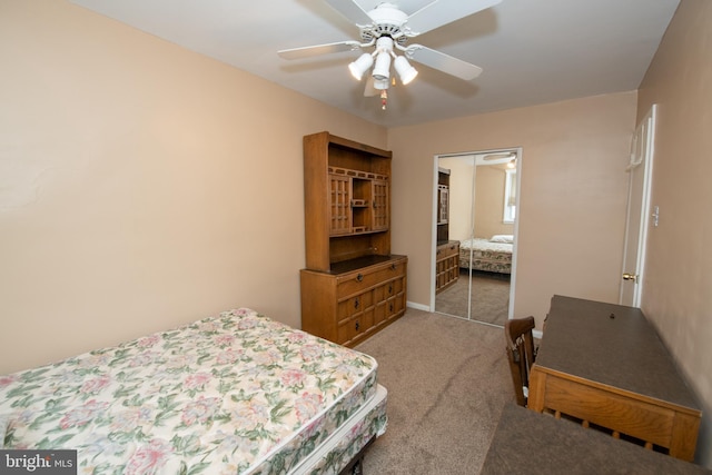 bedroom with a closet, light carpet, and a ceiling fan