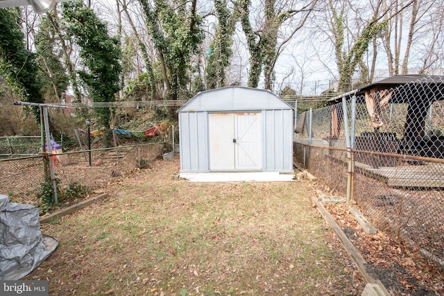 view of shed with fence