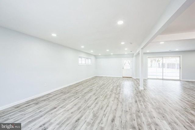 interior space featuring recessed lighting, baseboards, and light wood-style floors