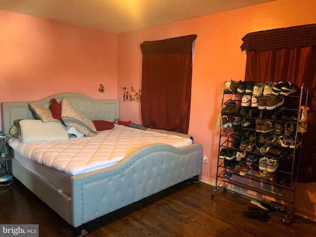 bedroom with wood finished floors