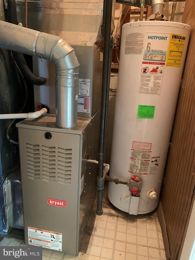 utilities featuring water heater and heating unit