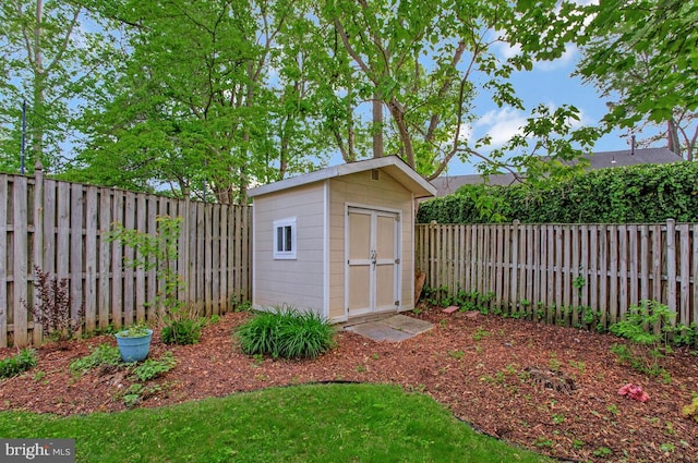 view of shed with a fenced backyard