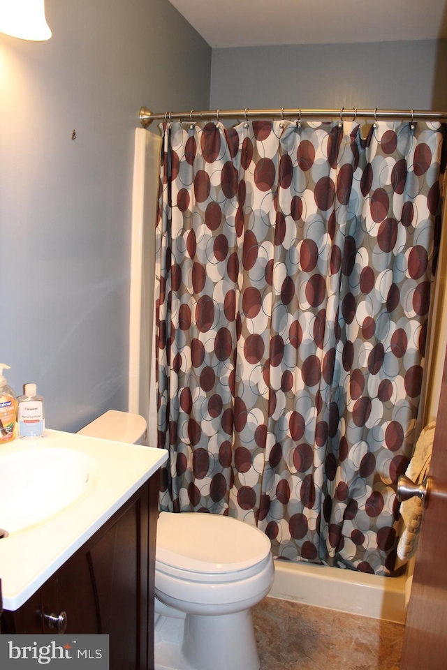 full bath featuring vanity, a shower with shower curtain, toilet, and tile patterned flooring