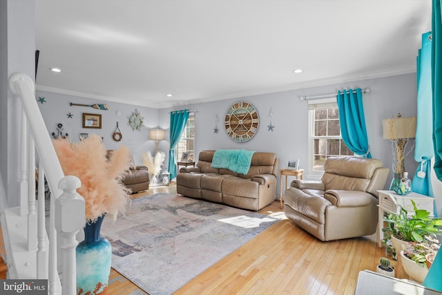 living area with recessed lighting, ornamental molding, and wood-type flooring