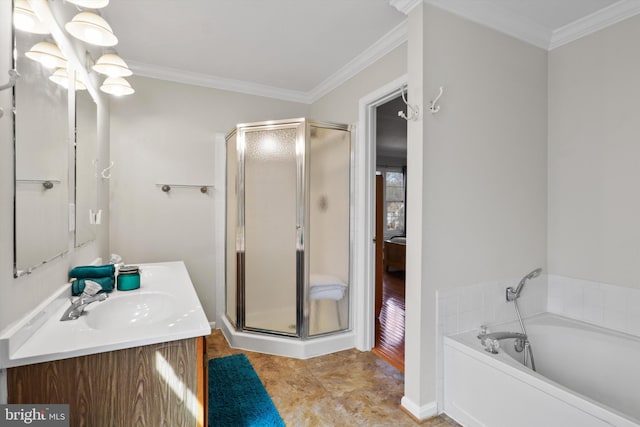 bathroom featuring a garden tub, vanity, a shower stall, and crown molding