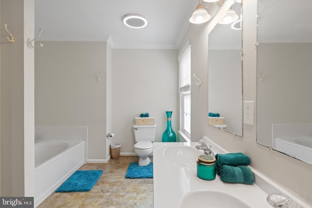 full bath featuring a bath, double vanity, ornamental molding, a sink, and toilet