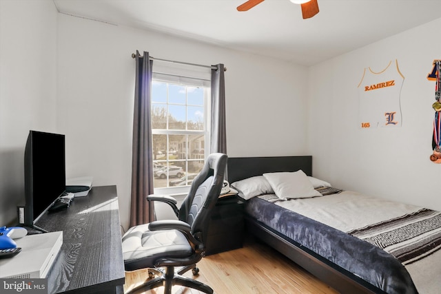 bedroom featuring a ceiling fan and light wood finished floors