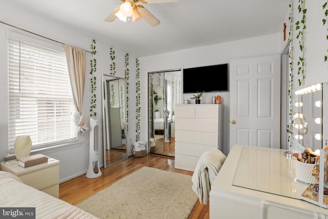 bedroom with light wood-style floors and ceiling fan