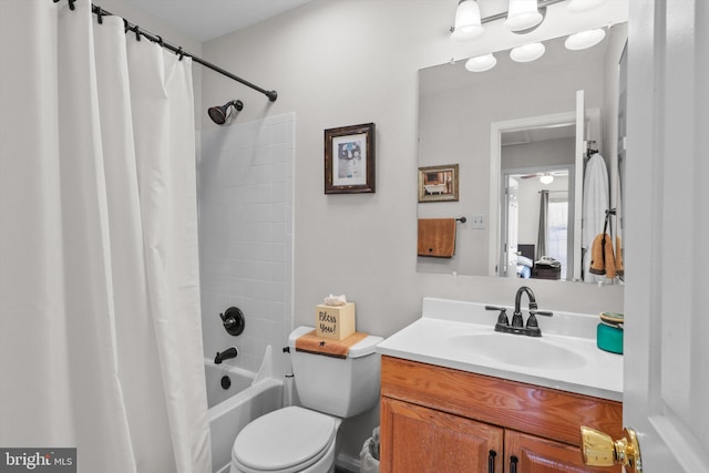 full bathroom featuring shower / tub combo, toilet, and vanity