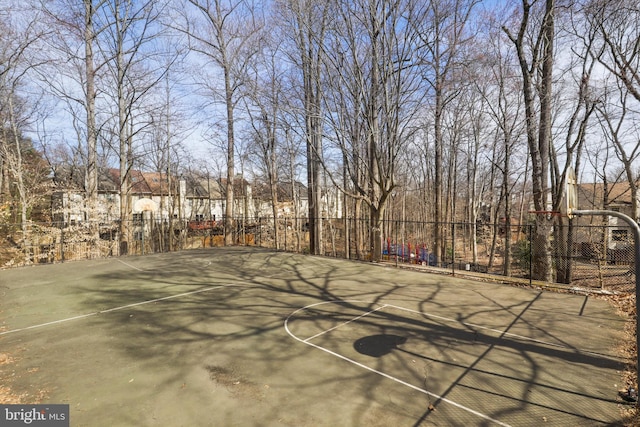 view of sport court featuring community basketball court and fence