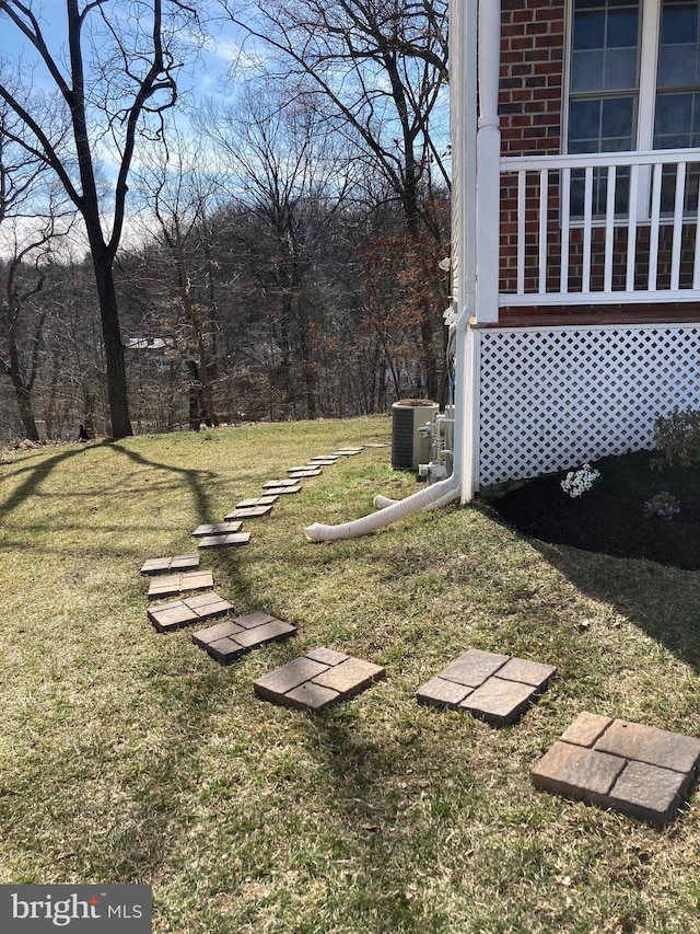 view of yard featuring central AC unit