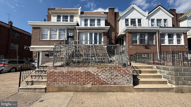 view of front of home with brick siding