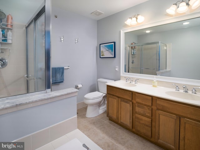 bathroom featuring a shower stall, visible vents, tile patterned floors, and a sink