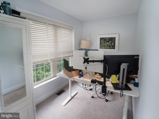 office featuring visible vents, baseboards, and carpet