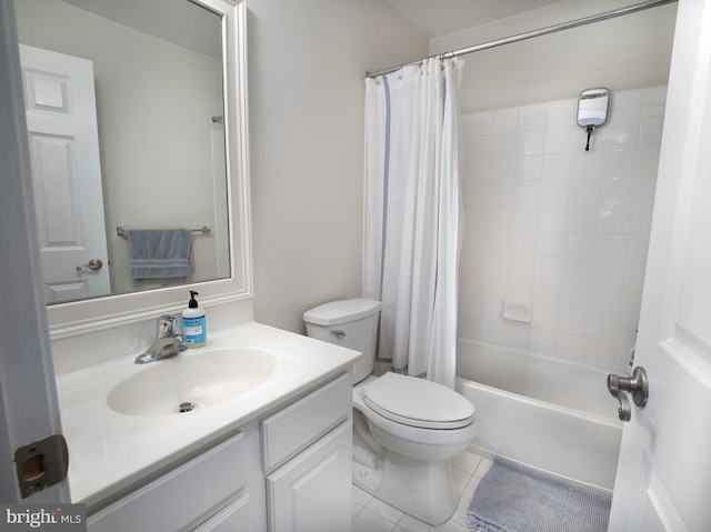 full bath with vanity, tile patterned floors, toilet, and shower / bath combo