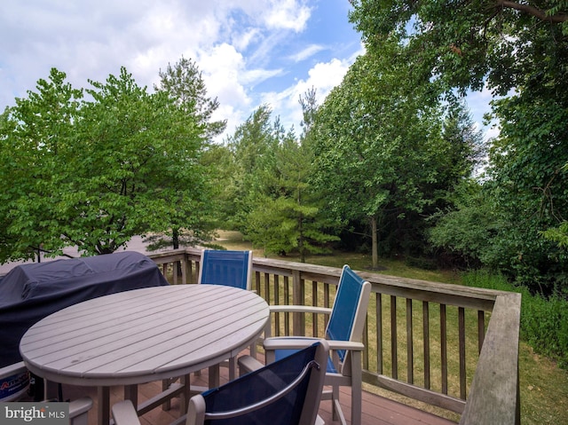 wooden deck with outdoor dining space