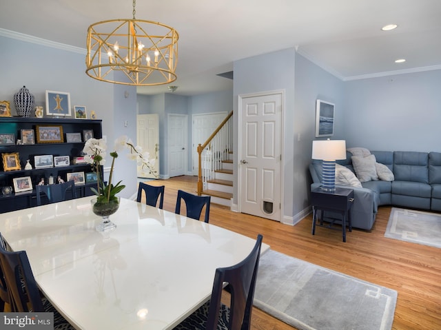 dining space with baseboards, light wood finished floors, recessed lighting, stairs, and crown molding