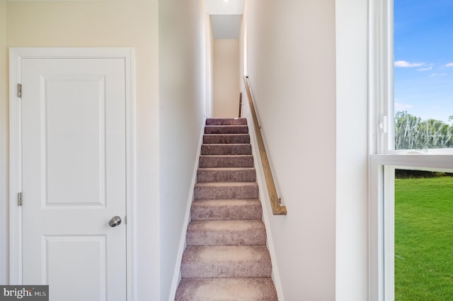 stairs featuring baseboards