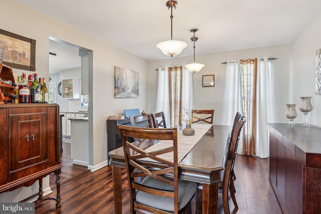 dining space featuring dark wood finished floors