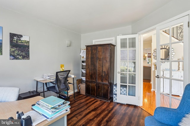 office with french doors and wood finished floors