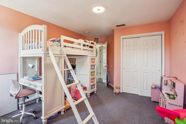 bedroom featuring a closet, visible vents, and carpet floors