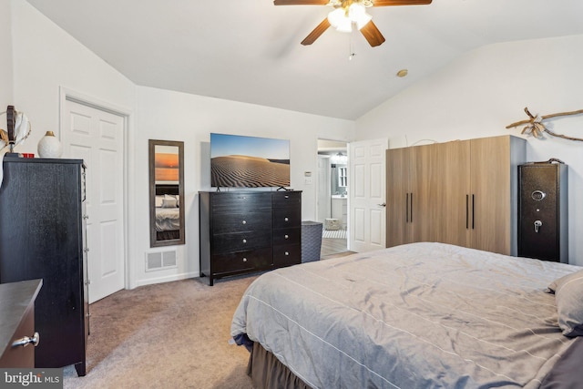 bedroom featuring visible vents, a ceiling fan, lofted ceiling, and carpet floors