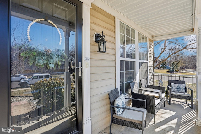 balcony featuring a porch