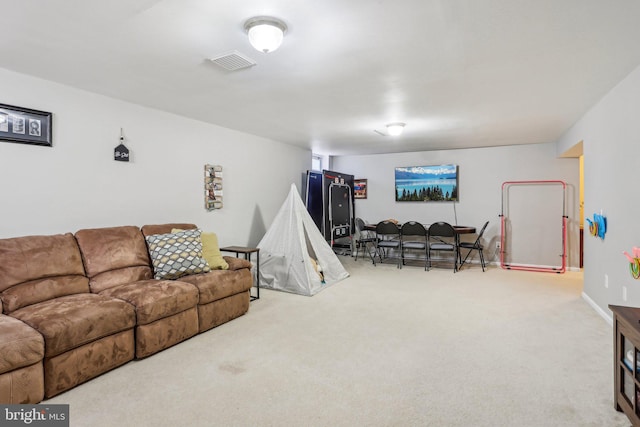 living room featuring visible vents and carpet flooring