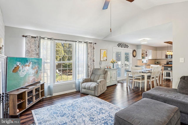 living area featuring visible vents, french doors, lofted ceiling, ceiling fan, and dark wood-style flooring