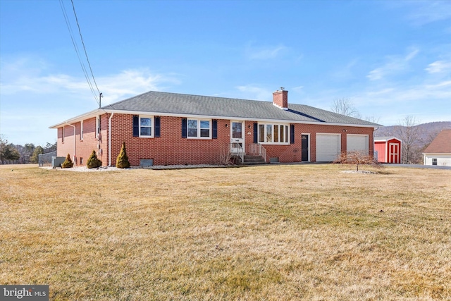 ranch-style home featuring brick siding, a shingled roof, a front yard, a chimney, and an attached garage