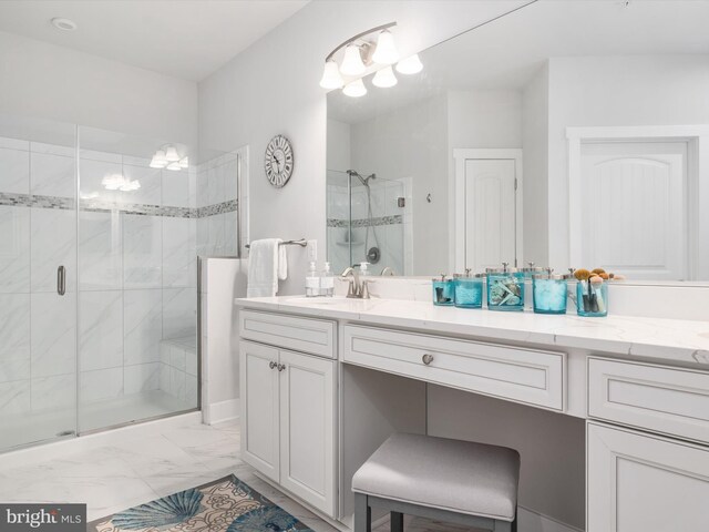 full bathroom with a stall shower, marble finish floor, and vanity