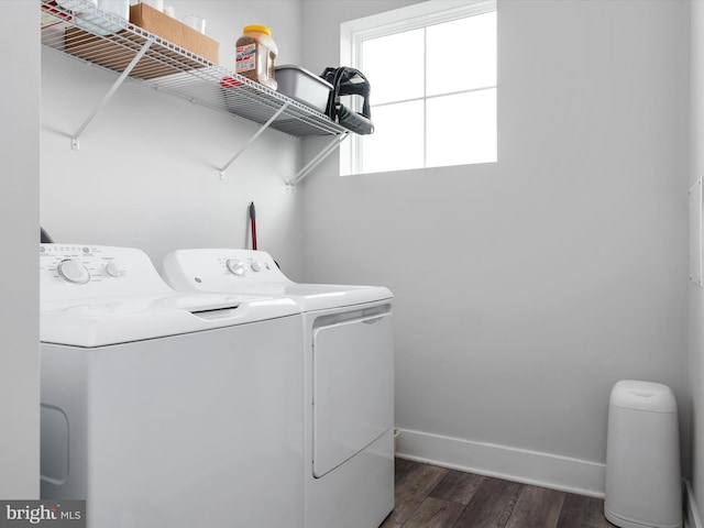 laundry area featuring dark wood-style floors, washing machine and dryer, laundry area, and baseboards