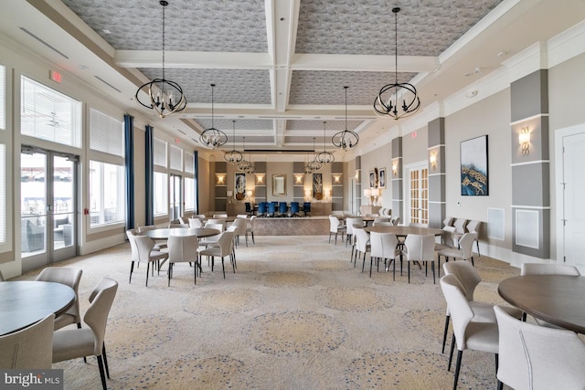 dining area with a high ceiling, beamed ceiling, coffered ceiling, and a notable chandelier