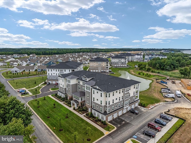 bird's eye view featuring a residential view and a water view