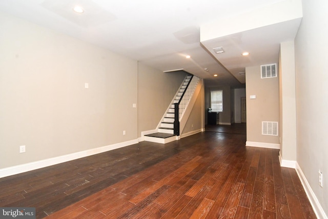 interior space with visible vents, stairs, baseboards, and wood finished floors