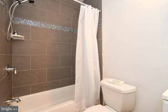 full bathroom with toilet and shower / bath combo with shower curtain