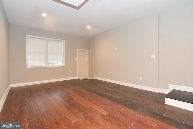 unfurnished room featuring recessed lighting, baseboards, and dark wood-style flooring