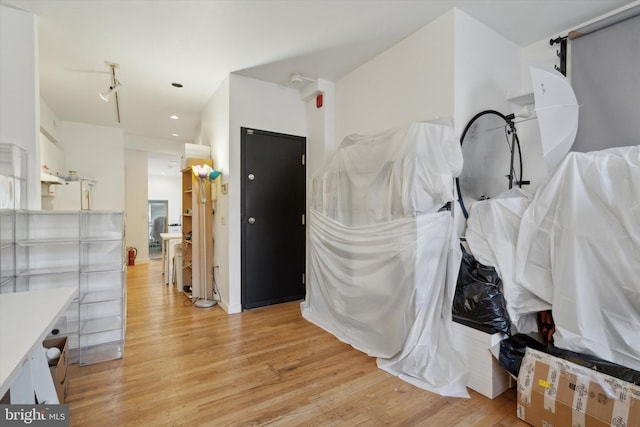 interior space featuring light wood finished floors and recessed lighting