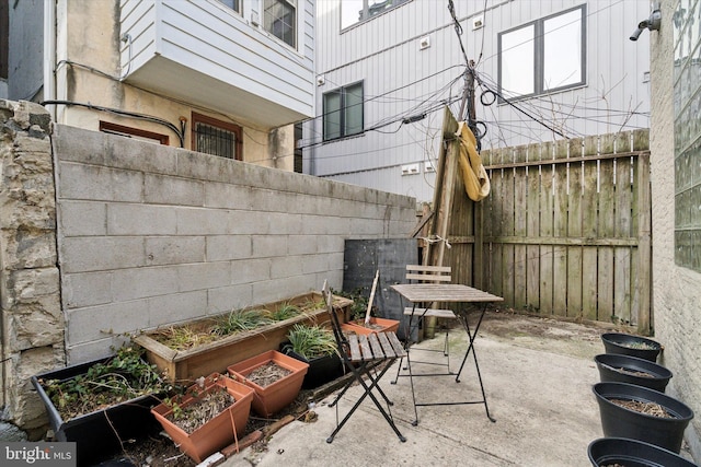 view of patio with a garden and a fenced backyard