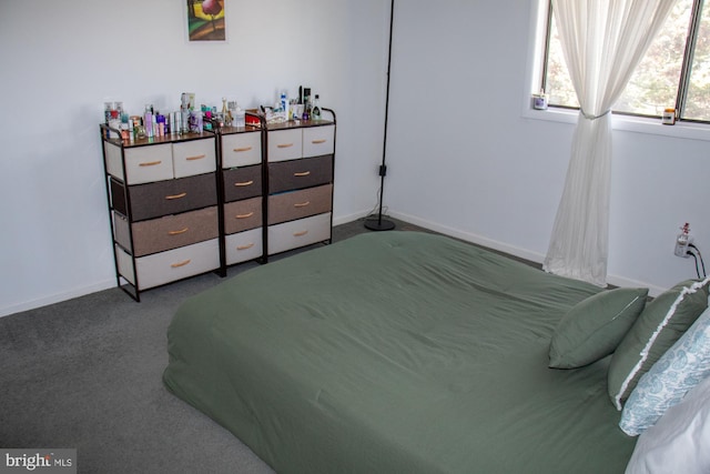 bedroom with carpet flooring and baseboards