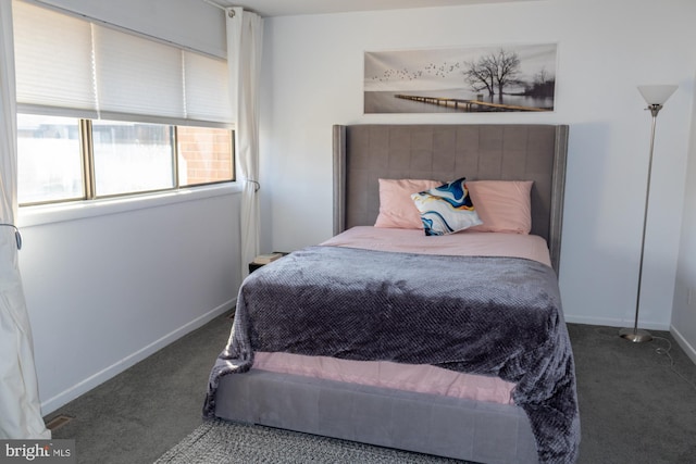 carpeted bedroom with baseboards