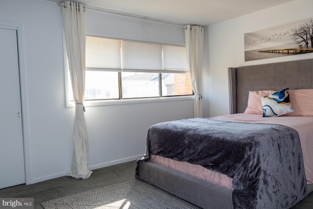 carpeted bedroom with baseboards