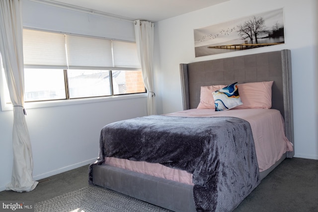 carpeted bedroom with baseboards