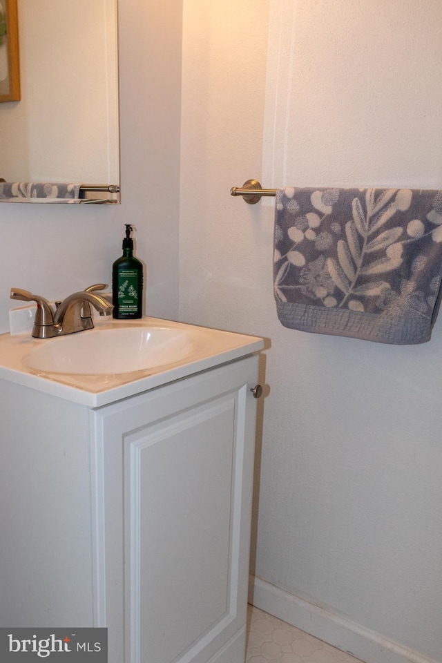 bathroom featuring vanity and baseboards