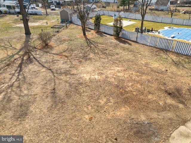 view of yard with a residential view and a fenced backyard