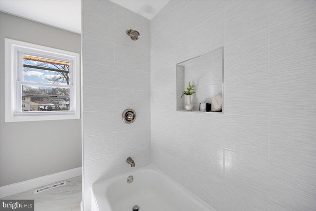 full bath with visible vents, shower / bathing tub combination, and baseboards